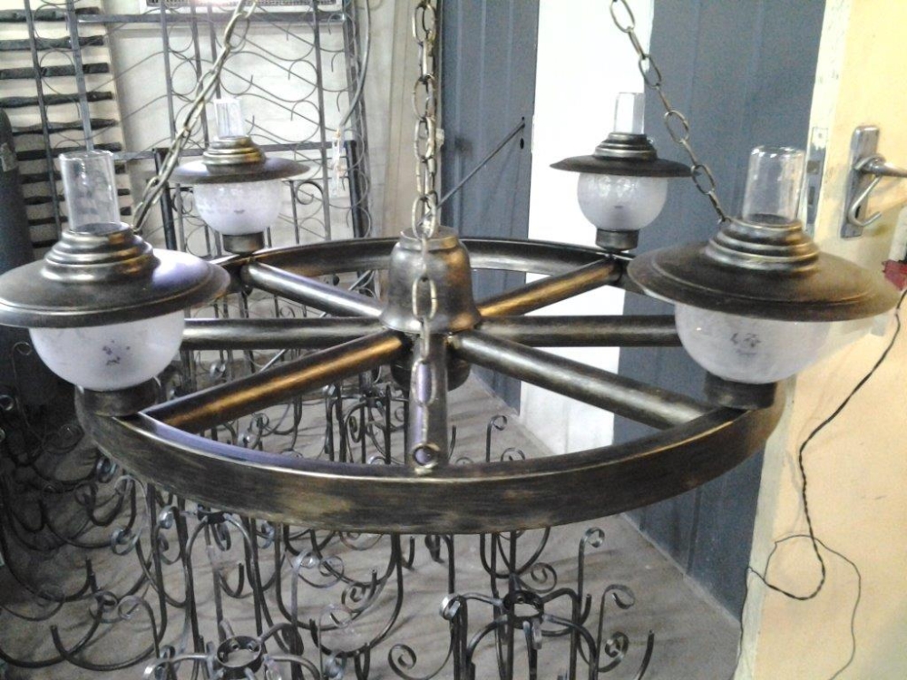 Wrought iron wagon wheel chandelier made by Exclusivio Wrought Iron Designs